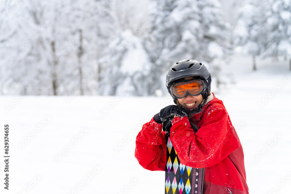 Portrait of Asian woman practice snowboarding on snow mountain at ski resort. Attractive girl enjoy and fun outdoor active lifestyle travel nature and winter extreme sport training on holiday vacation Portrait of Asian woman practice snowboarding on snow mountain at ski resort. Attractive girl enjoy and fun outdoor active lifestyle travel nature and winter extreme sport training on holiday vacation