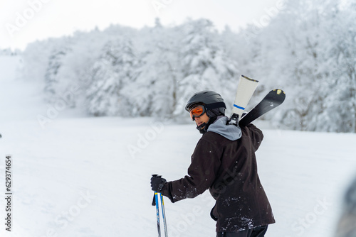 Portrait of Asian man athlete practice skiing on snow mountain at ski resort. Handsome guy enjoy and fun outdoor active lifestyle travel nature and winter extreme sport training on holiday vacation.