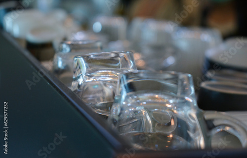 The washed coffee mugs are placed in the tray.