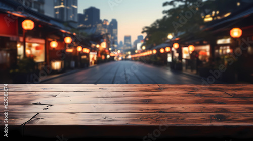 The empty wooden table top with blur background of Tokyo