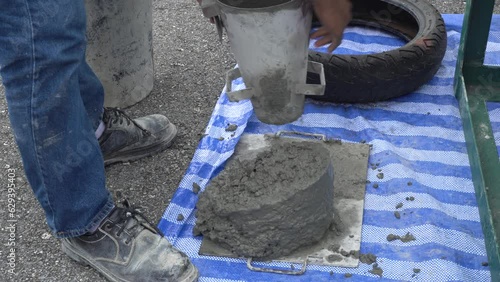 Concrete slump testing of mixing concrete checking workability in field construction site