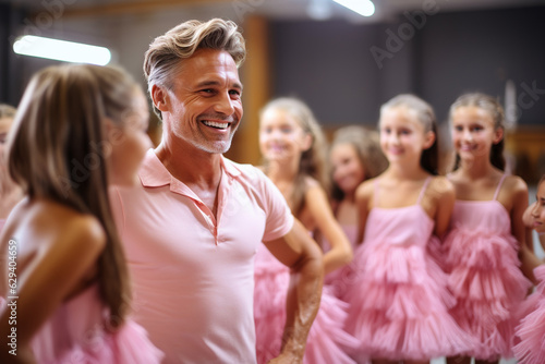 Man wearing pink tutu skirt and having fun ballet class with girls on the background ballet class . © AI_images