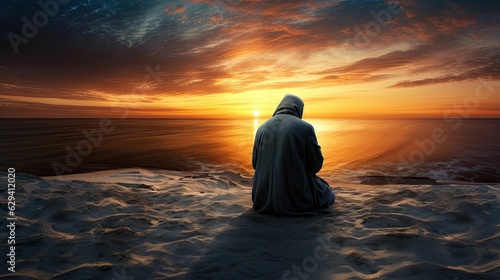 photograph of A Muslim man is facing the sunset and praying namaz or salah. Serene holy night background.generative ai photo