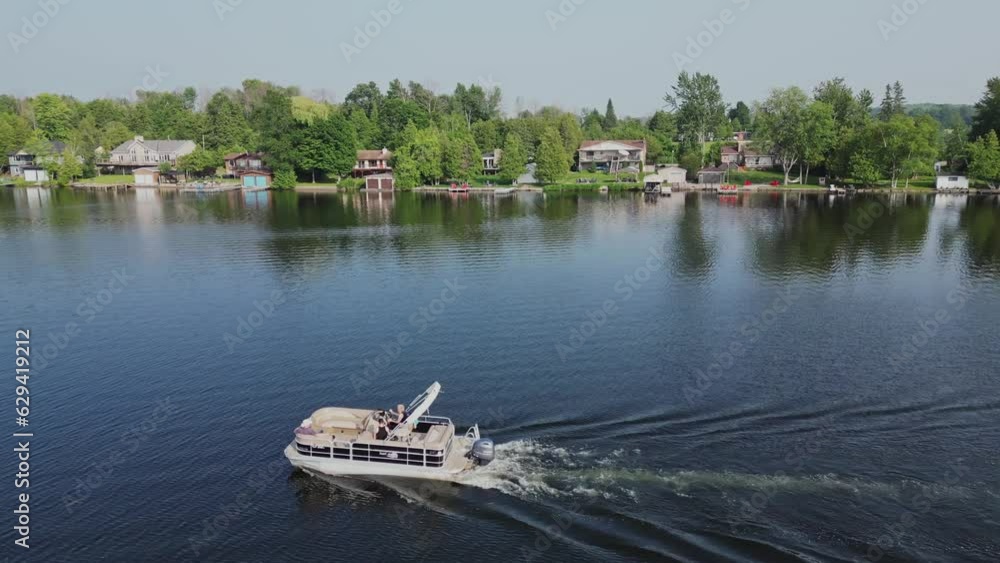 Boat Sailing On Scenic Lake At Daytime - aerial drone shot Boat Sailing On Scenic Lake At Daytime - aerial drone shot