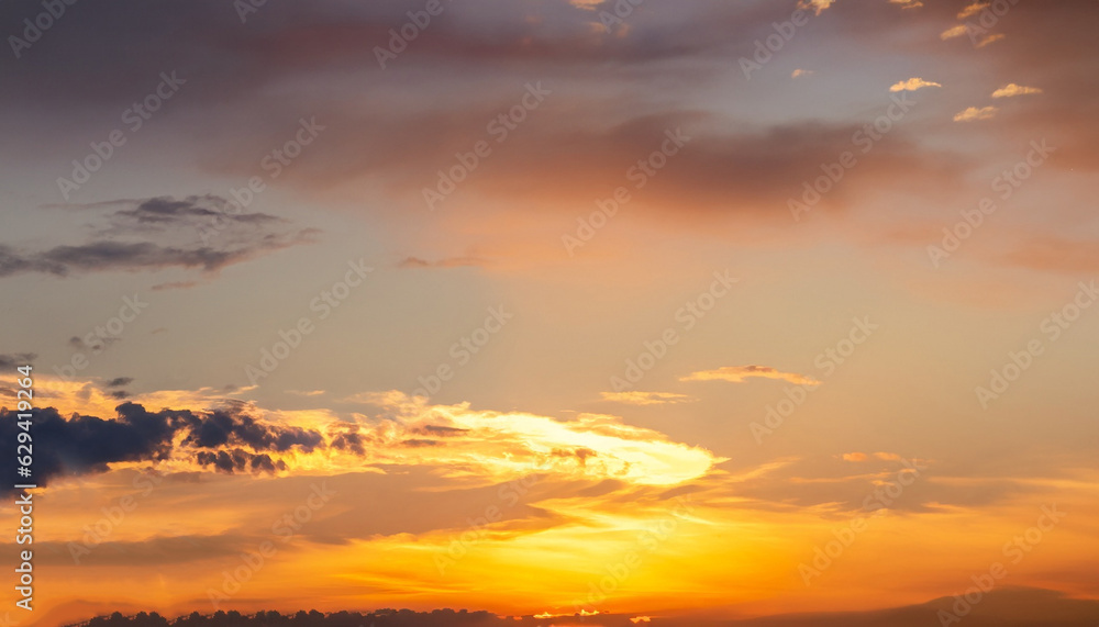 Evening, Colorful sunset sky background in Golden Sky Hour with Romantic Orange, Yellow sunlight clouds Summer season