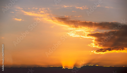 Obraz na plátně Evening, Colorful sunset sky background in Golden Sky Hour with Romantic Orange,