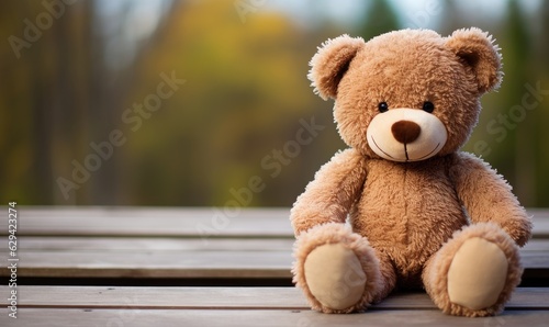 With its fluffy fur and cute button eyes, the teddy bear sat patiently on the bed