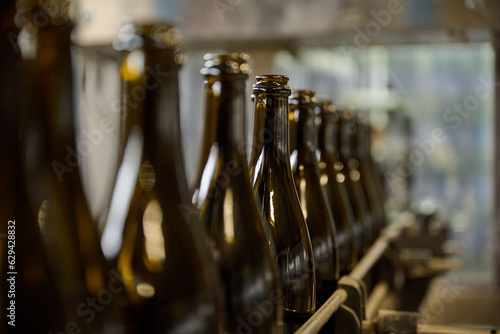 empty wine bottles on a manufacturing line at a modern winery