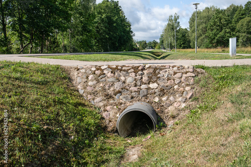 Trough the pipe. Stormwater and road infrastructure ditch