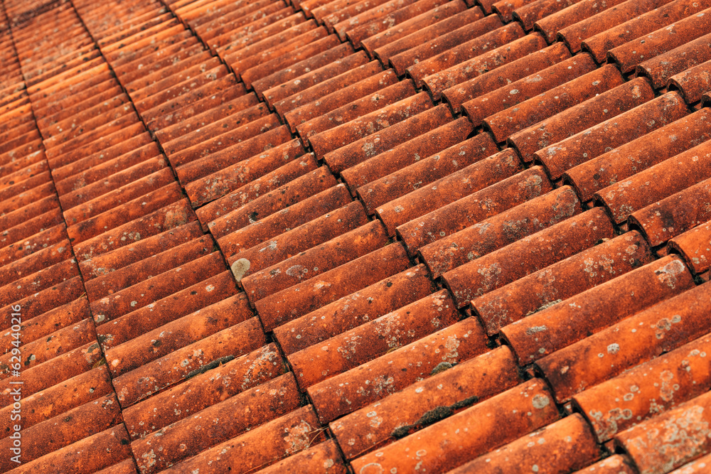 Old rustic terracotta roof tiles pattern as background Old rustic terracotta roof tiles pattern as background