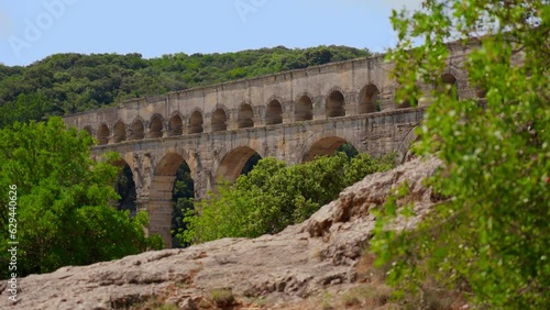 Video shoot of  Pont du Gard, a famous Roman Aqueduct on the Gardon River in France. Architecture and historical heritage concept. photo