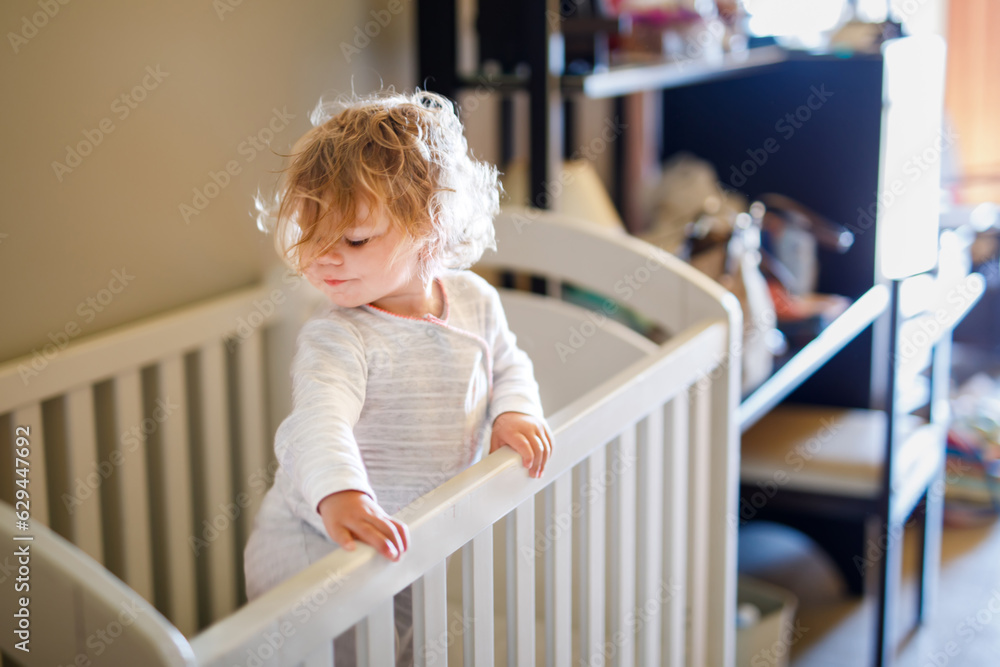 Cute Little Baby Girl Lying in Cot after Sleeping. Healthy Happy Child