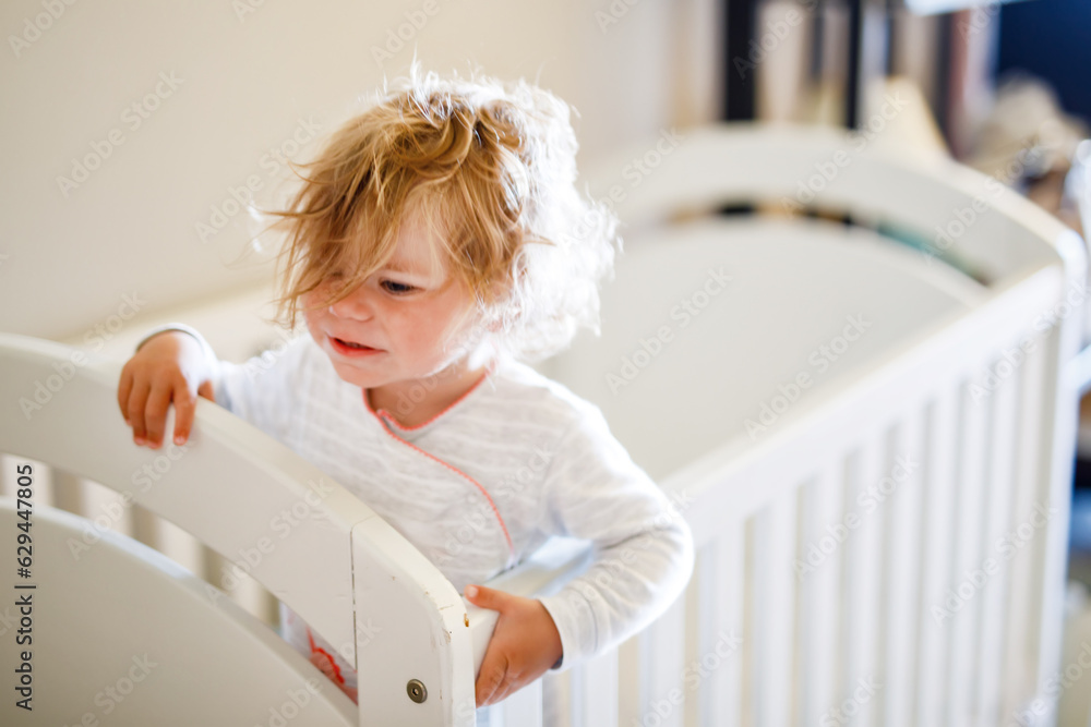Cute Little Baby Girl Lying in Cot after Sleeping. Healthy Happy Child