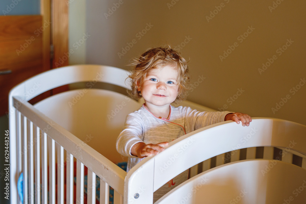 Cute Little Baby Girl Lying in Cot after Sleeping. Healthy Happy Child