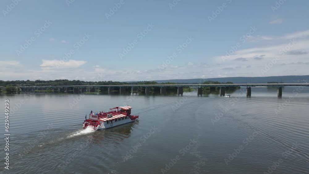 Blue boat sailing on calm ocean, group enjoying day, peaceful journey on water. Blue boat sailing on calm ocean, group enjoying day, peaceful journey on water.