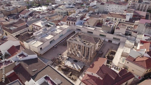 Aerial view circling above remains of the temple of Diana in the centre of historic Merida, Spain photo