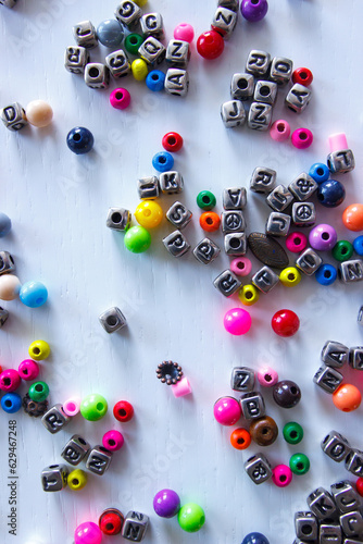 Background from different colored beads with numbers and symbols