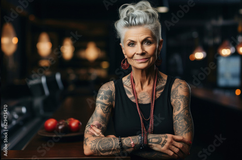 Portrait of senior woman with tattoos. She stands happy and smiling in the midst of modern gym equipment. Fictional person. Generated Ai