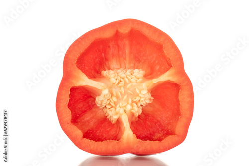 One half of sweet red pepper, macro, isolated on white background.