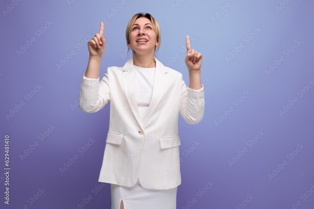 pretty young blond career woman in business style shows her hands to the sides pretty young blond career woman in business style shows her hands to the sides