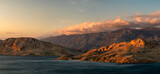 The rugged, rocky landscape of the island of Pag in Croatia, in the beautiful warm light of the setting sun.