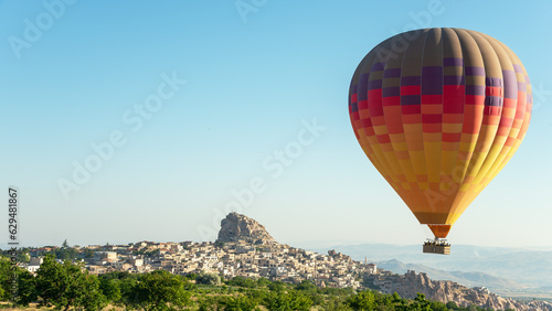 Big colorful hot air balloon flying in Cappadocia, Turkey.