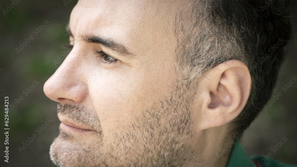 Obraz premium profile portrait of man with gray hair and beard