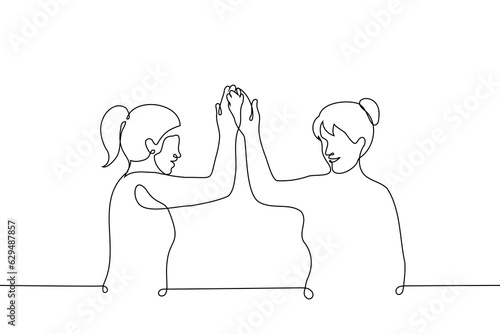 women stands giving each other five smiling - one line drawing vector. the concept of female solidarity, female friendship and teamwork