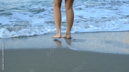 woman walking by the sea
