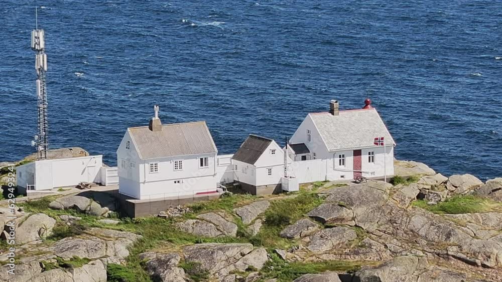 Stavernsodden Small Lighthouse Stands On Rocky Coastal Sea Of Larvik In Norway. aerial Stavernsodden Small Lighthouse Stands On Rocky Coastal Sea Of Larvik In Norway. aerial