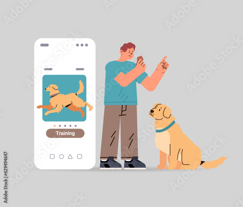 guy owner with cute dog using training app best friends domestic animal friendship concept
