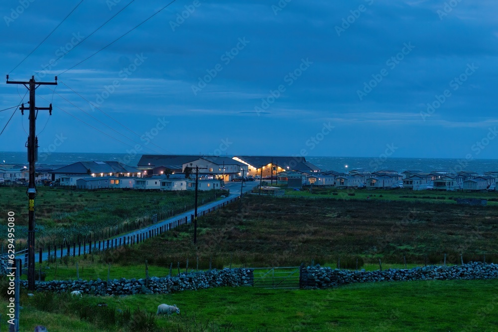 road to caravan park by the sea at night in Talybont, UK