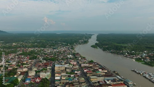 Aerial view of Cotabato City with small houses near the river. Mindanao, Philippines. photo