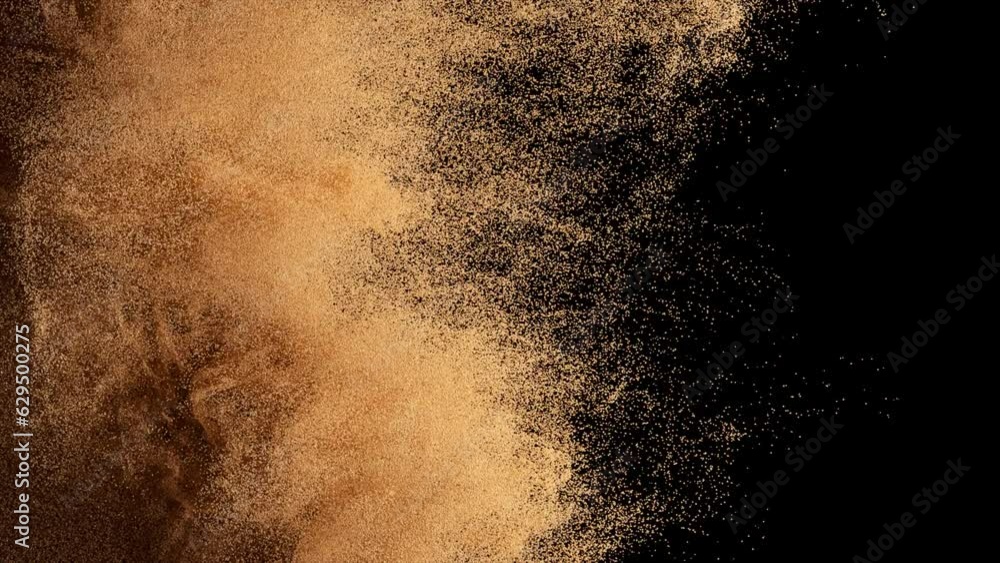 Bronze particles fly on a black background. The wind blows away colored sand. Powder. Spray. Texture. 3d animation.