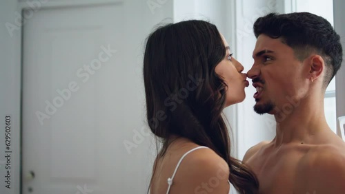 Playful lovers having fun at hotel closeup. Funny woman joking with boyfriend