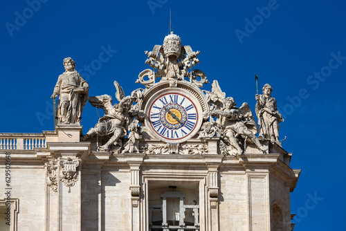 Canvas Print Facade of  Saint Peter's Basilica with decorative clock on a top, Vatican, Rome,