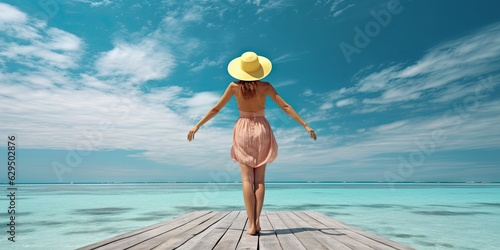Travel concept. Beautiful woman standing on beach and sea with copy space © Thares2020
