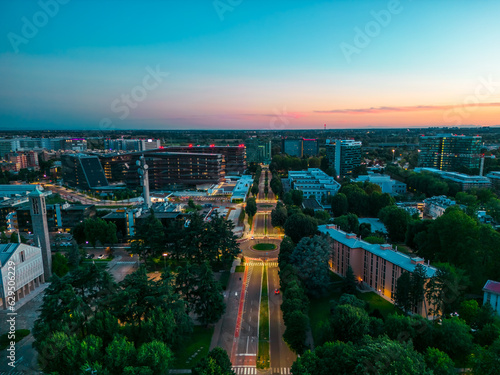 Schilderij op canvas Drone photography at sunset city of San Donato Milanese, Milan, Italy