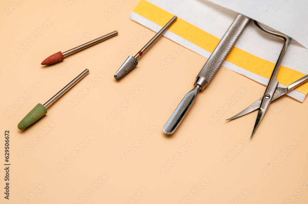 Manicure and pedicure tools on pink background. Nail salon banner design template. Beauty treatment and hand care concept Manicure and pedicure tools on pink background. Nail salon banner design template. Beauty treatment and hand care concept