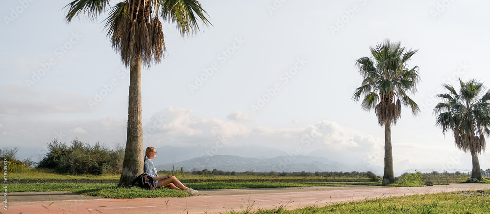 Remote work.Girl freelancer works remotely on the sea shore.workation, remote work,WFVH,Van Life vibes work from vacation home,work travel,remotely work.Travelling.Work from vacation remotely Remote work.Girl freelancer works remotely on the sea shore.workation, remote work,WFVH,Van Life vibes work from vacation home,work travel,remotely work.Travelling.Work from vacation remotely