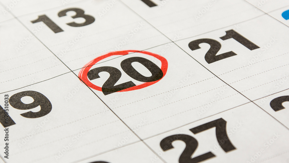 A close-up calendar sheet highlighting the 20th A close-up calendar sheet highlighting the 20th
