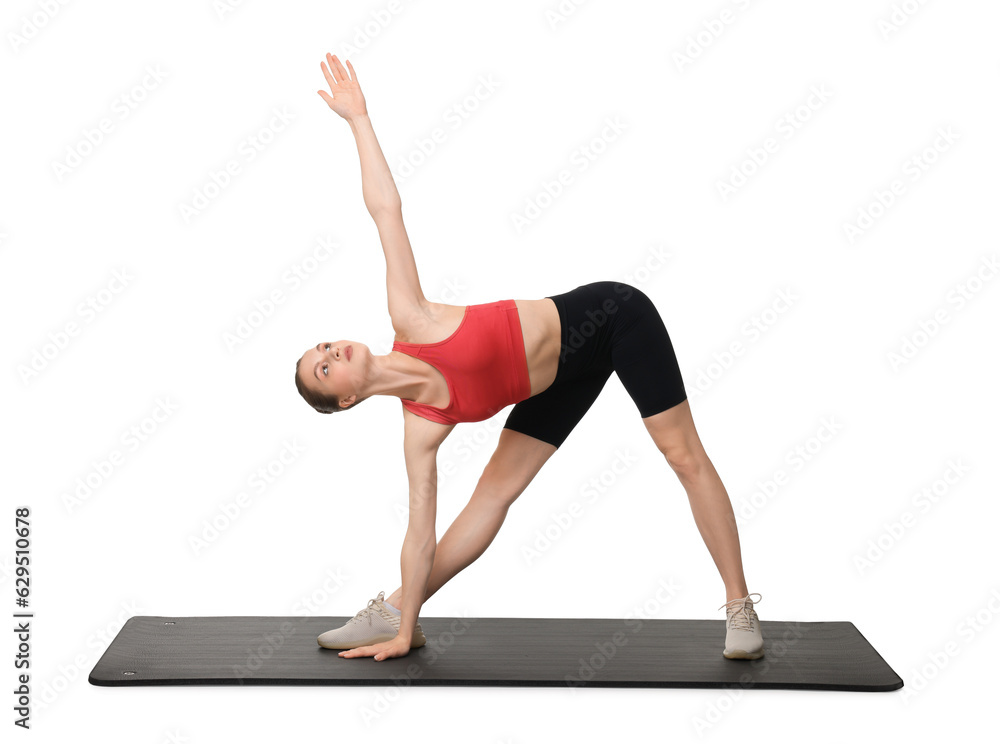 Fototapeta premium Yoga workout. Young woman stretching on white background