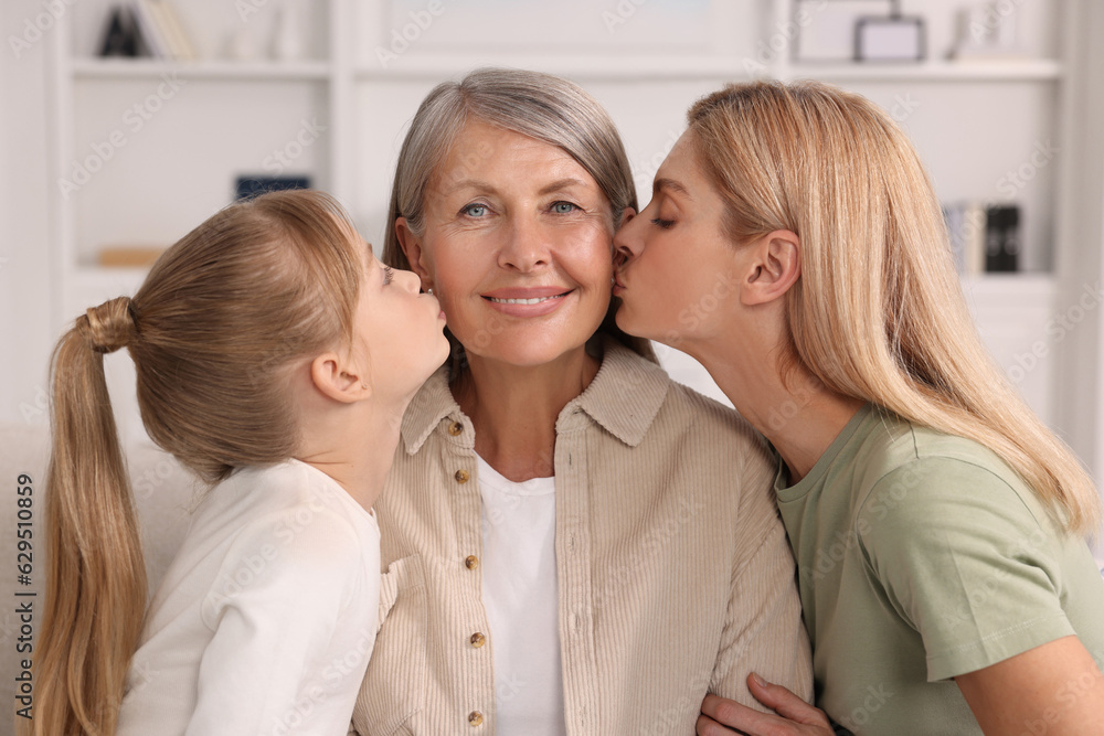Three generations. Happy grandmother, her daughter and granddaughter at home Three generations. Happy grandmother, her daughter and granddaughter at home