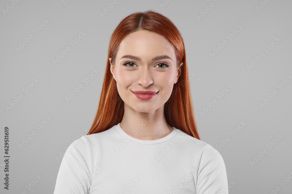 Portrait of beautiful young woman on light gray background Portrait of beautiful young woman on light gray background