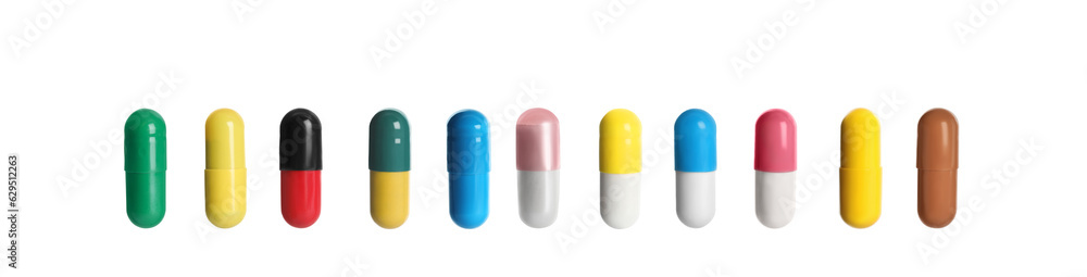 Set of different color pills in row isolated on white Set of different color pills in row isolated on white