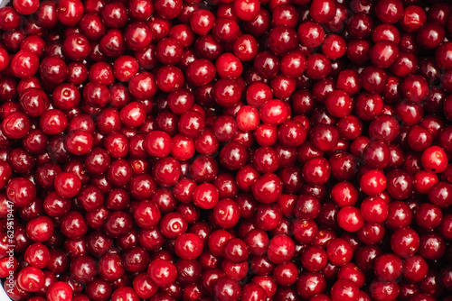 Harvest of red cherries on the market counter. Cherry background. Cherry top view. Cherry flat design. Fruit macro.