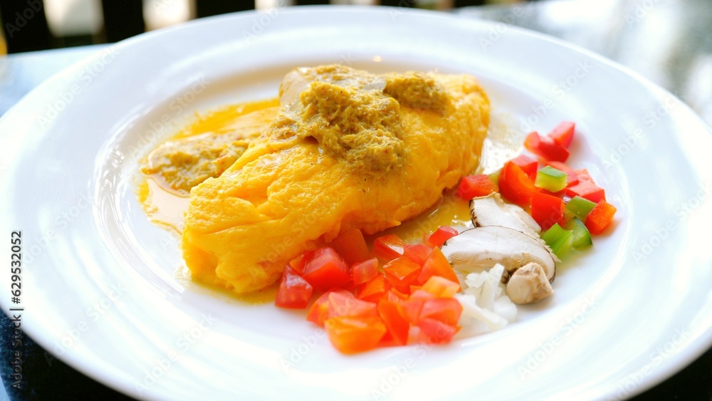 Breakfast Buffet in Luxury Hotel with Stuffed Omelette. Healthy food in outdoor cafe. Concept of a delicious and nutritious morning meal. Breakfast Buffet in Luxury Hotel with Stuffed Omelette. Healthy food in outdoor cafe. Concept of a delicious and nutritious morning meal.