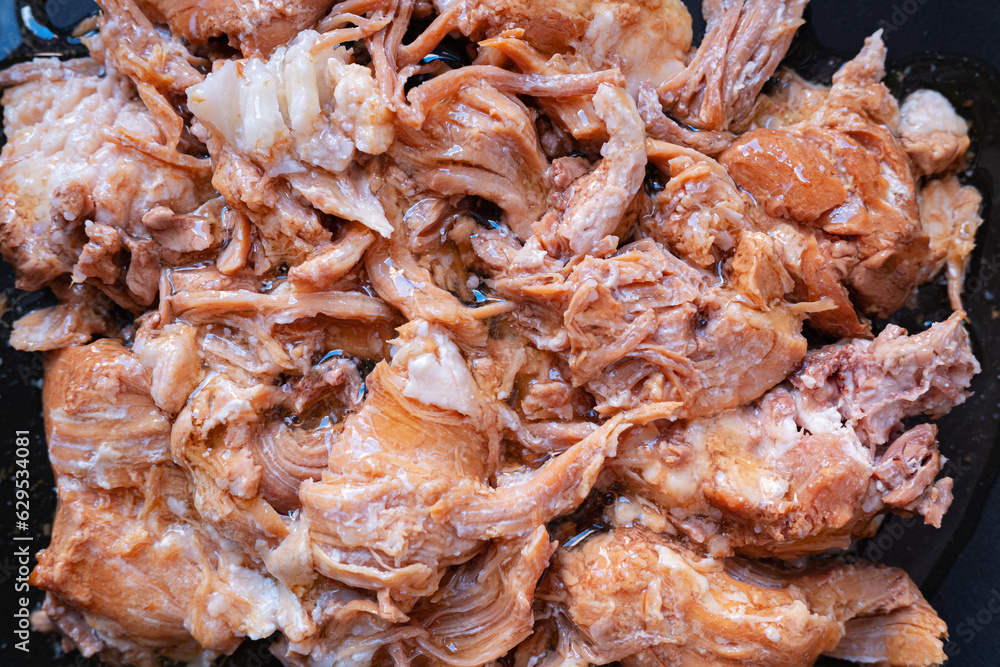 Texture of the canned long-term storage stewed pork meat. Food background image. Texture of the canned long-term storage stewed pork meat. Food background image.