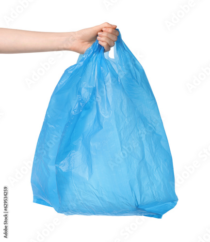 Woman holding light blue plastic bag on white background, closeup