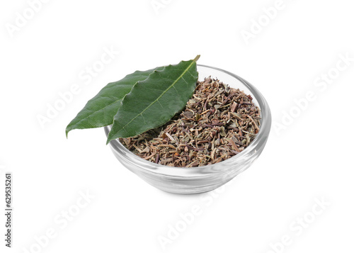 Bowl with different spices and fresh bay leaves on white background